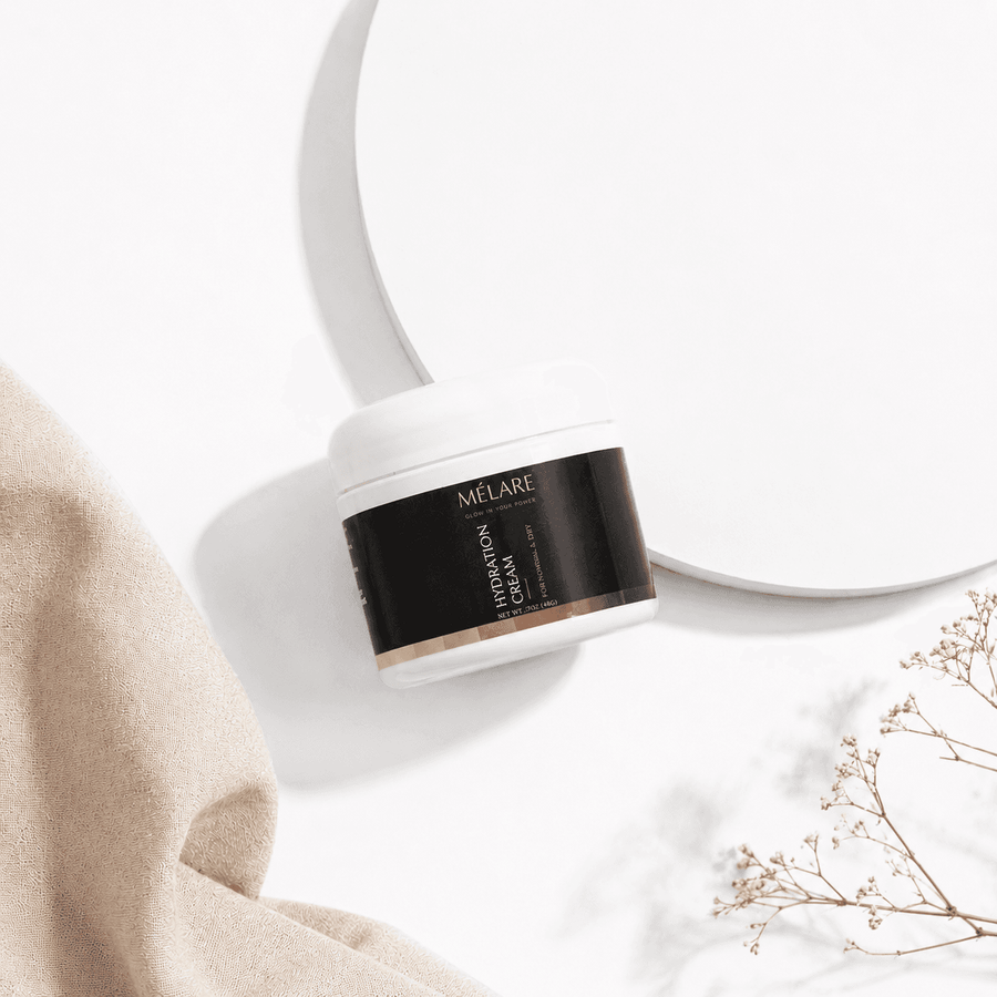 Mélare Hydration Cream for facial care, showing a jar of moisturizing cream with a smooth, creamy texture and clean packaging.
